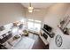 Open concept living room with a fireplace, hardwood floors, and plenty of natural light at 14918 Dawnhaven Dr, Westfield, IN 46074
