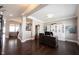 Comfortable home office with hardwood floors, desk, built-in bookcase, natural light and staircase at 14918 Dawnhaven Dr, Westfield, IN 46074