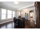 Lovely home office featuring hard wood floors, a large desk, many windows and neutral wall paint at 14918 Dawnhaven Dr, Westfield, IN 46074