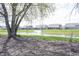 Scenic view of a pond with a fountain, surrounded by lush greenery and walking paths at 14918 Dawnhaven Dr, Westfield, IN 46074