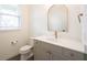 Bathroom featuring modern fixtures, faucet, and vanity with gray cabinets at 15109 Larchwood Dr, Westfield, IN 46074