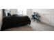 Well-lit bedroom featuring a comfortable bed and a dedicated desk area, ideal for studying or working from home at 15109 Larchwood Dr, Westfield, IN 46074