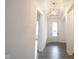 Bright entryway featuring a statement light fixture, hardwood floors, and a view of the home's interior at 15109 Larchwood Dr, Westfield, IN 46074