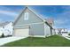 Exterior of a two-story home with a blue-gray siding, lawn, and an attached garage at 15109 Larchwood Dr, Westfield, IN 46074