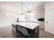 Modern kitchen featuring a large center island with seating and pendant lights at 15109 Larchwood Dr, Westfield, IN 46074