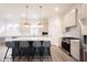 Contemporary kitchen with a spacious island, stainless steel appliances, and stylish pendant lighting at 15109 Larchwood Dr, Westfield, IN 46074