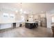 An open layout with island seating, stainless steel appliances, and easy access to the living area at 15109 Larchwood Dr, Westfield, IN 46074