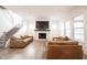 Spacious living room with a modern fireplace, hardwood floors, and comfortable seating arrangement at 15109 Larchwood Dr, Westfield, IN 46074