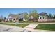 Street view of Harmony neighborhood with white brick accent homes at 15109 Larchwood Dr, Westfield, IN 46074