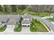 Drone's eye view of a residential community with well-kept lawns, and varied architectural styles at 15591 Heatherbank Dr, Westfield, IN 46074