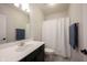 Bright bathroom featuring a single sink vanity, neutral walls, and a shower with a decorative curtain at 15591 Heatherbank Dr, Westfield, IN 46074