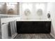 Elegant bathroom featuring a double sink vanity with granite countertop and modern lighting at 15591 Heatherbank Dr, Westfield, IN 46074