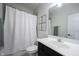 Clean bathroom features a shower, vanity, framed botanical art, and contemporary fixtures at 15591 Heatherbank Dr, Westfield, IN 46074