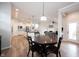 View of the dining area leading into the kitchen and living room, showcasing the open floor plan at 15591 Heatherbank Dr, Westfield, IN 46074