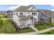 Stunning two-story home showcasing a lovely front porch, lush landscaping, and timeless architectural details at 15591 Heatherbank Dr, Westfield, IN 46074