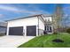 Beautiful home featuring a manicured lawn, attached two-car garage and charming front porch at 15591 Heatherbank Dr, Westfield, IN 46074