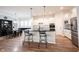 Modern kitchen featuring white cabinets, a black island, and stainless steel appliances at 15591 Heatherbank Dr, Westfield, IN 46074