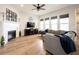 Bright living room with a fireplace, large sectional sofa, and lots of natural light at 15591 Heatherbank Dr, Westfield, IN 46074