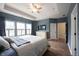 Spacious main bedroom with hardwood floors, ample natural light, and a ceiling fan at 15591 Heatherbank Dr, Westfield, IN 46074
