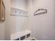 Mudroom with built-in bench seating, overhead shelf with hooks, and storage cubbies at 15591 Heatherbank Dr, Westfield, IN 46074