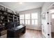 Home office featuring a dark wood desk, built-in bookshelves, and natural light at 15591 Heatherbank Dr, Westfield, IN 46074