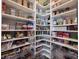 Walk-in pantry with organized shelving, providing ample storage space for groceries and kitchen essentials at 15591 Heatherbank Dr, Westfield, IN 46074