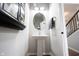 Powder room features a pedestal sink, decorative mirror, and neutral color palette at 15591 Heatherbank Dr, Westfield, IN 46074