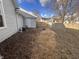 Fenced backyard features side of the home and potential for outdoor activities and relaxation at 159 N Lincoln St, Martinsville, IN 46151