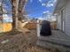 Backyard featuring a deck, grill, tall tree, and a wooden fence providing privacy at 159 N Lincoln St, Martinsville, IN 46151