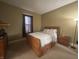 Comfortable bedroom with a full sized bed, dresser, and window that provides natural light at 159 N Lincoln St, Martinsville, IN 46151