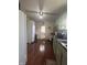 Functional kitchen with hardwood floors, dark countertops, and a door leading to the outside at 159 N Lincoln St, Martinsville, IN 46151