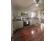Efficient kitchen with green cabinetry, stainless steel appliances, and hardwood floors for a vintage look at 159 N Lincoln St, Martinsville, IN 46151