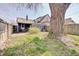 Spacious backyard featuring a patio area, mature trees, and a well-maintained lawn at 1614 S Talbott St, Indianapolis, IN 46225