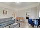 Inviting living room featuring wood-look flooring, comfortable seating, and abundant natural light at 1614 S Talbott St, Indianapolis, IN 46225