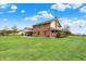 Spacious backyard with lush greenery and a beautiful home at 1687 E 600 N, Whiteland, IN 46184