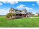 Beautiful house with a red brick porch, well-manicured lawn, and mature tree at 1687 E 600 N, Whiteland, IN 46184