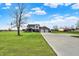 Expansive home featuring a long driveway, green lawn, and a two-car garage at 1687 E 600 N, Whiteland, IN 46184