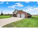 Beautiful home featuring a two-car garage, and an expansive green lawn at 1687 E 600 N, Whiteland, IN 46184