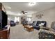 Spacious living room featuring plush seating, soft carpet, and stylish decor at 1687 E 600 N, Whiteland, IN 46184