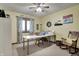 Bright office with a window, desk, rocking chair, and carpet flooring at 1687 E 600 N, Whiteland, IN 46184