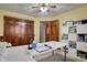 Spacious office featuring a large closet, desk, carpet flooring, and a ceiling fan at 1687 E 600 N, Whiteland, IN 46184