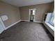 Inviting living room featuring carpet flooring, a neutral color scheme, and a bright window for natural light at 1830 Nichol Ave, Anderson, IN 46016