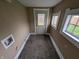 Mudroom features windows, door, and unfinished wall with washer and dryer hook-ups at 1830 Nichol Ave, Anderson, IN 46016