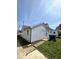 Image of a backyard with grass, trash cans, and access to the property at 2111 Central Ave, Anderson, IN 46016