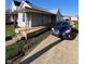This single-story home features a covered porch and convenient parking in the driveway at 2111 Central Ave, Anderson, IN 46016