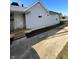 The exterior features a covered front porch and vinyl siding, with a driveway to the side at 2111 Central Ave, Anderson, IN 46016