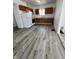 Bright kitchen featuring wood cabinets, white appliances and new flooring at 2111 Central Ave, Anderson, IN 46016