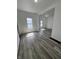 Open-concept living room with new flooring, fresh paint, and abundant natural light at 2111 Central Ave, Anderson, IN 46016