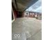 Concrete back patio featuring a partial view of the home's exterior at 2146 Lawrence Ave, Indianapolis, IN 46227