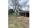 Backyard featuring a shed, patio, and bench with room for landscaping at 2146 Lawrence Ave, Indianapolis, IN 46227